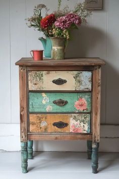 an old dresser with flowers on top