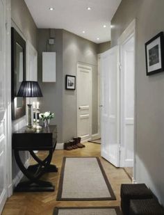 a hallway decorated with white and brown accents