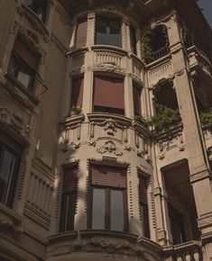 an old building with many windows and balconies