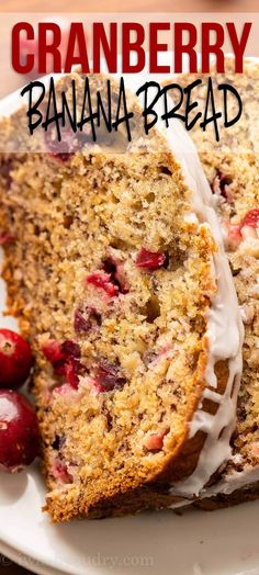 a close up of a piece of cake on a plate with cherries and icing