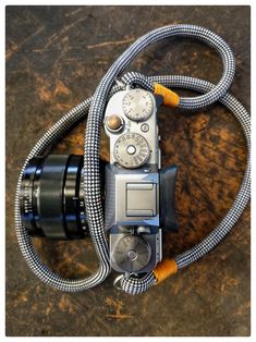 an old camera with a hose attached to it