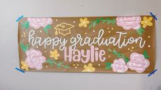 a sign that says happy graduation haylie on it