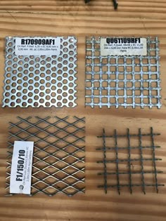 four different types of metal grates on a wooden table