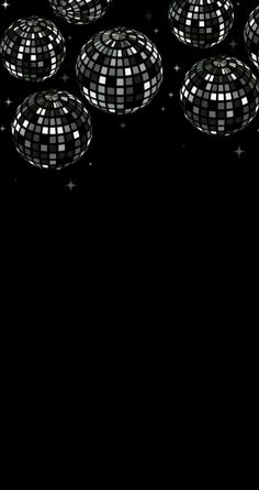 many shiny disco balls on a black background with stars in the middle and one ball is upside down