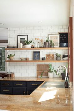 the kitchen counter is clean and ready to be used as a planter for plants