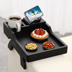 a tray that has some food on it and a cup of coffee next to it