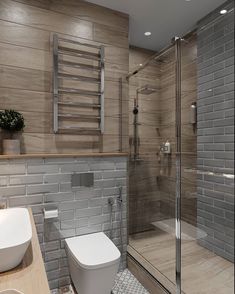 a bathroom with a toilet, sink and shower