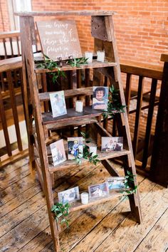 an old wooden ladder with photos on it