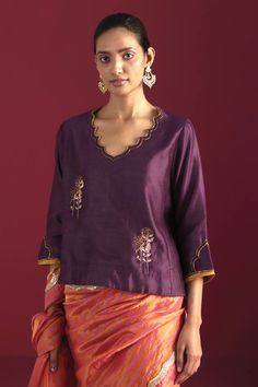 Purple chanderi blouse with embroidery on neckline, sleeves and front. Components: 1 Pattern: Hand Embroidered Type Of Work: Floral Neckline: Scalloped V Sleeve Type: Three Quarter Fabric: Chanderi, Lining: Shantoon Color: Purple Other Details:  Length: 19 inches Model height: 5ft 9inches, wearing size M Note: Saree worn by the model is not for sale. Disclaimer: Since all our products are sustainable, touched by human hands be it weaving, block printing, or embroidery, there might be slight impe Velvet Kurta, Kurta Patterns, Brown Satin, Blouse For Women, Kurta With Pants, Velvet Pants, Silk Pants, Block Printing, Antique Lace