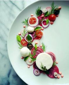 a white plate topped with lots of veggies