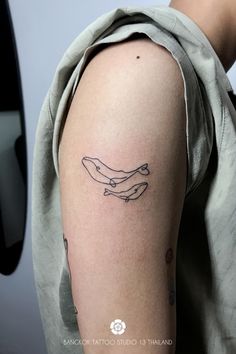 a person with a tattoo on their arm