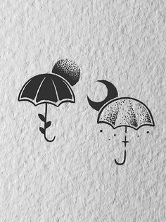 two umbrellas with faces drawn on them