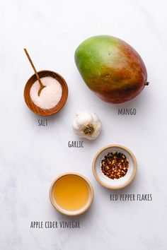 ingredients to make mango tea laid out on a white surface