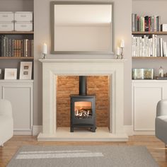 a living room with a fire place and bookshelves