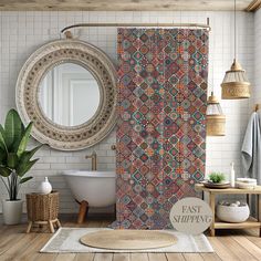 a bathroom with a shower curtain, rug and potted plant on the wooden floor