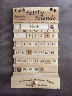 a wooden calendar hanging on the wall