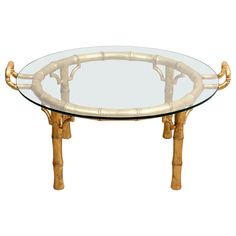 a round glass table with bamboo legs