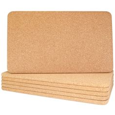 four cork placemats stacked on top of each other in front of a white background