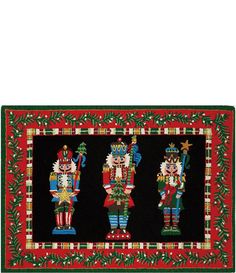 three nutcrackers on a black background with red and green border