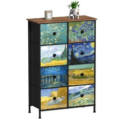 a cabinet with four drawers painted in different colors and pictures on the front, one door open