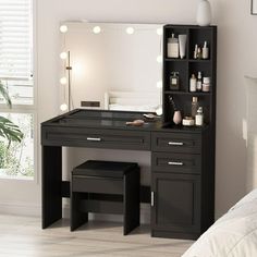 a black vanity with lights on it in a bedroom