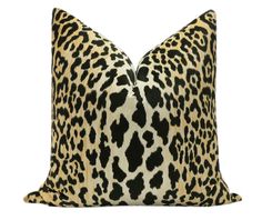 a leopard print pillow on a white background