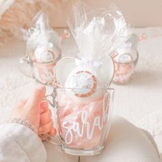 a person holding a cup filled with candy