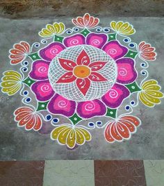 a colorful flower design painted on the ground