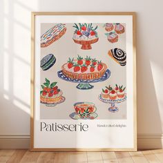 a framed poster with an image of cakes and strawberries