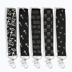 four black lanyards with white crosses and words on them, all tied together