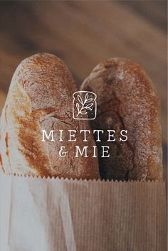 two loaves of bread in a paper bag with the words miette's & me on it