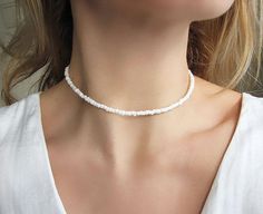 Pearl White Choker Necklace White Beaded Choker Dainty Necklace Glass Choker Dainty and elegant all pearl white beaded choker with glass tiny seed beads. DESCRIPTION Made from 2mm glass seed beads and closes with a silver plated clasp and 2 inches adjustable chain. SIZE Necklace is 13 inches and can be adjusted up to 15 inches with a 2 inches extender chain. Please let me know if you would like a different length. WRAPPING - All ZafireniaDainty jewelry arrive gift wrapped in a cute bag or box re White Choker Necklace, Beaded Chocker, White Choker, White Beaded Necklaces, Real Flower Jewelry, Buy Necklace, Hippie Jewelry, White Necklace, Silver 925 Necklace