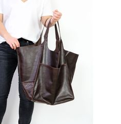 "Oversized bag - large leather tote bag Large and stylish tote bag made from high quality leather. Spacious interior provides room for all the daily essentials and more. It is large enough to hold all your weekend essentials. This bag is perfect as your everyday bag, which can fit an IPAD, A4 files, books, magazines, cosmetic bag as well as many accessories. * Includes internal pockets for mobile phone and other small items. * Top closure magnet for security Height: 39 cm / 15.3\" Height from to Large Leather Bags For Everyday Use, Large Leather Satchel For Shopping, Large Leather Bag With Double Handle, Large Leather Tote Satchel, Large Leather Everyday Bags, Large Brown Leather Shoulder Bag, Leather Weekender Bag With Large Capacity For Errands, Large Capacity Leather Weekender Bag For Errands, Slouchy Tote