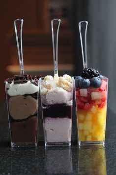 four different types of ice cream in cups