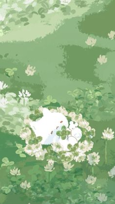 a white cat laying on top of a lush green field filled with water lilies