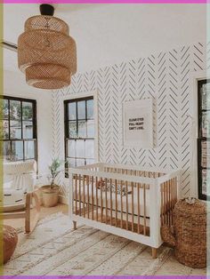 a baby's room with a crib in the middle