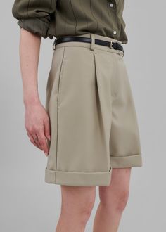 Color: Beige Midweight woven fabric Regular fit Pleated front detailing Side seam pockets Illusion back flap pockets Belt loops Zip fly Hook and bar closure Unlined 80% Polyester 20% Rayon Dry Clean By The Frankie Shop. Imported Suit Shorts, Denim Inspiration, Denim Suit, Corporate Wear, Classic Trousers, The Frankie Shop, Fashion Journals, Frankie Shop, Paris Woman