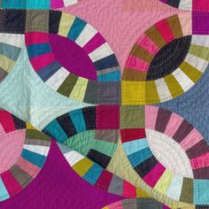 a colorful quilt with circles on it