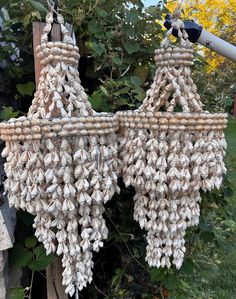 some kind of hanging item made out of shells