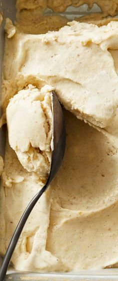 a scoop of ice cream in a pan with a spoon