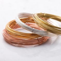 three different types of wire on a white surface