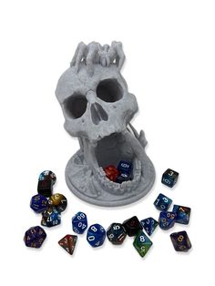 a skull with its mouth open surrounded by dice