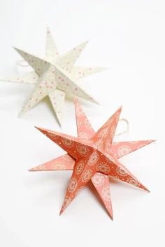 three paper stars sitting on top of each other