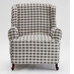 a black and white checkered chair with wooden legs