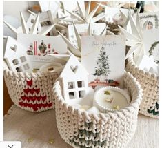 knitted baskets filled with small houses and cards