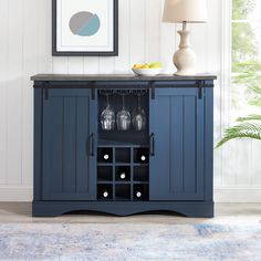 a blue cabinet with wine glasses on it