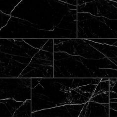 black marble tiles with white veining on the edges and bottom, all in different sizes