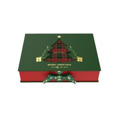 an open christmas gift box with a bow on the front and plaid wrapping around it