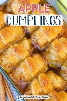 apple dumplings in a baking dish with cinnamon sticks