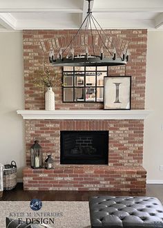 a living room with a brick fireplace and white walls